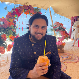 Tristan sipping on coconut juice