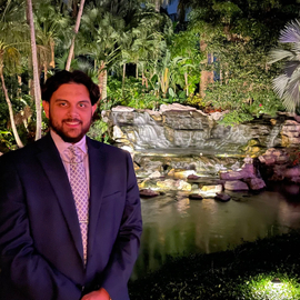 Tristan in front of the waterfall display